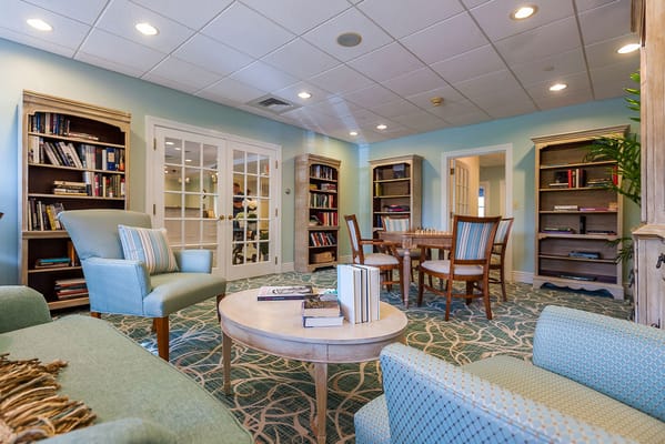 Interior common area with seating and bookshelves