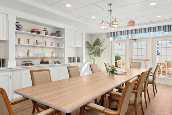 Bright common area with large dining table and decorations