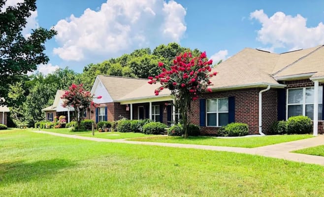 Exterior view of senior living apartments with landscaping