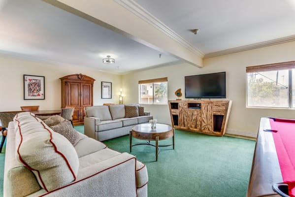 Cozy common area with seating and a TV