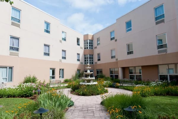 Beautiful courtyard garden with fountain and flowers