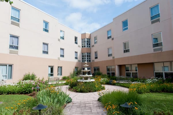 Beautiful courtyard garden with fountain and flowers