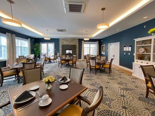 Well-furnished dining room with tables and chairs