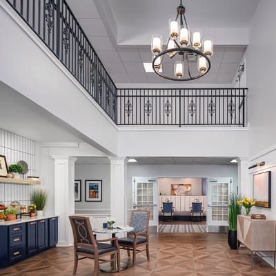 Bright interior common area with seating and artwork