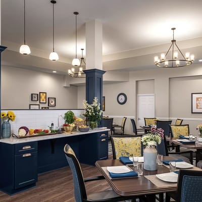 Dining area with neatly set tables and food displays