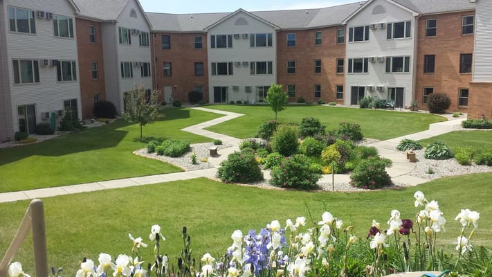 Beautiful landscaped courtyard with pathways and flowers