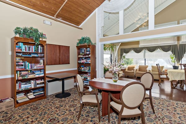 Bright common area with bookshelves and seating