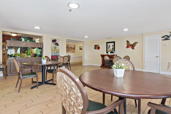 Bright dining area with tables and chairs