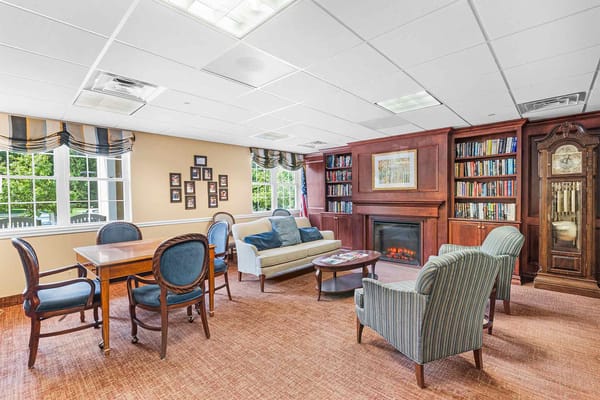 Cozy common area with seating and bookshelves