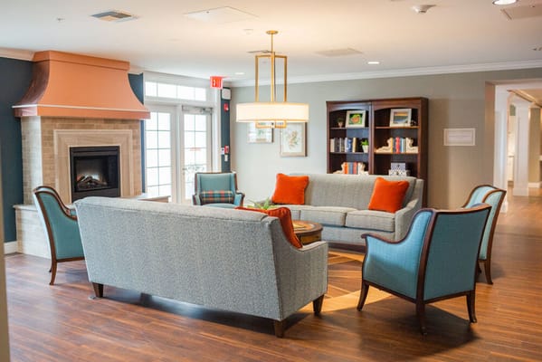 Cozy lounge area with a fireplace and seating