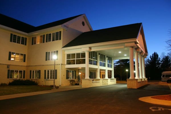 Exterior view of Colonial Villa at twilight