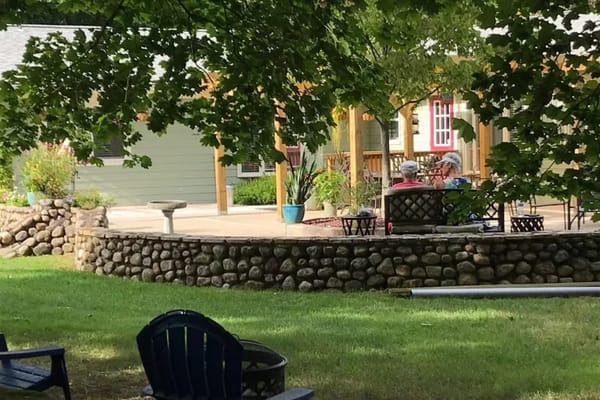 Residents enjoying the outdoor space in a garden area