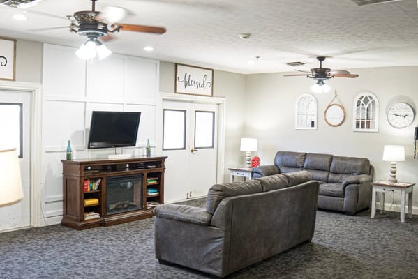 Cozy common area with sofas and TV