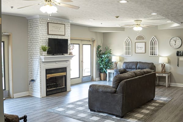 Spacious living room with modern decor and comfortable seating
