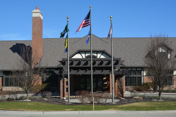 Entrance of Beacon Hill At Eastgate with flags