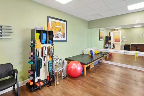 Therapy room with exercise equipment and colorful balls