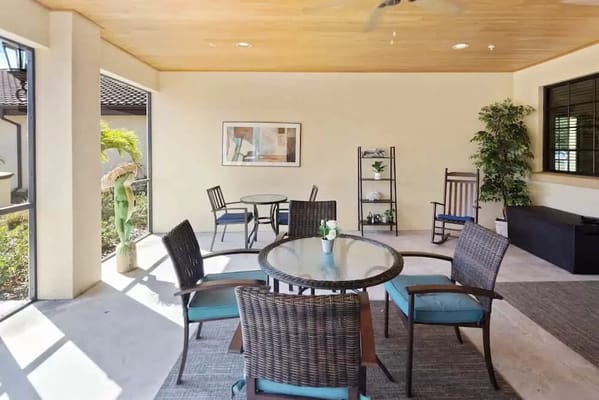 Outdoor seating area with tables and chairs