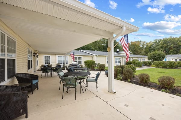 Patio area with tables and chairs at Granville Place