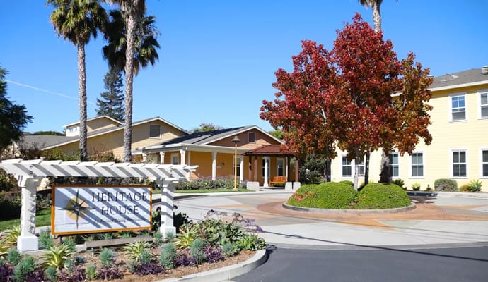 Exterior view of Heritage House with landscaping and signage