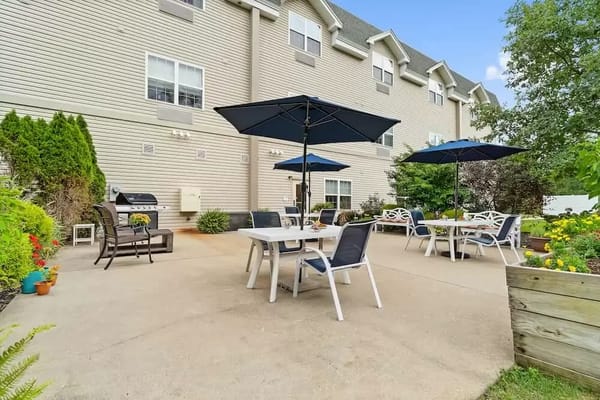 Outdoor patio area with seating and umbrellas