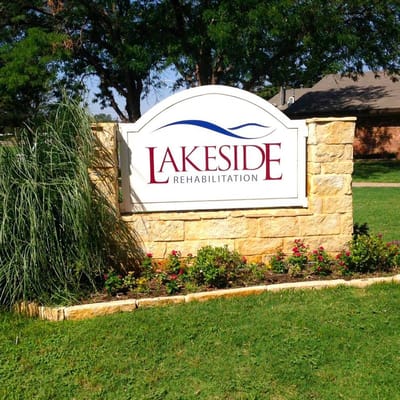 Signage for Lakeside Rehabilitation Center surrounded by greenery