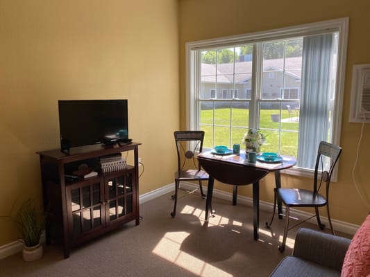 Interior living space with a table and TV