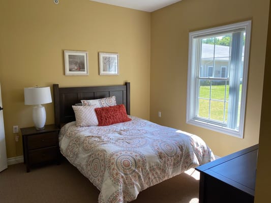 A well-furnished private resident room with natural light