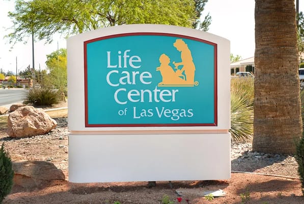 Life Care Center of Las Vegas logo on a sign