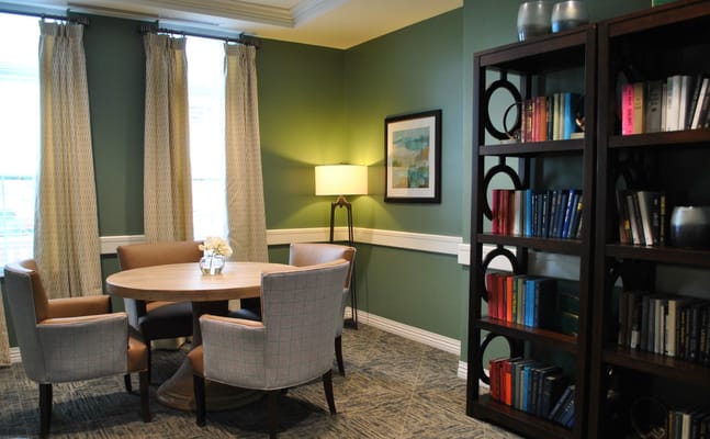 Interior common area with seating and bookshelves