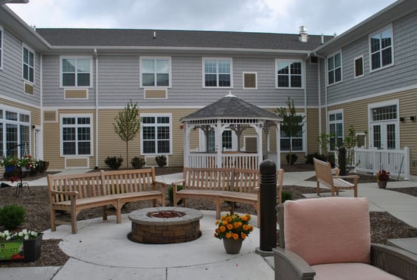 Outdoor courtyard with benches and a gazebo