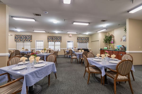 Dining room setup with tables and chairs