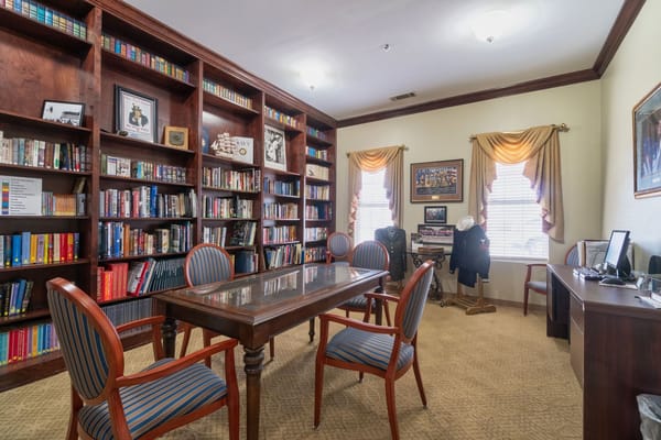 Cozy common area with bookshelves and seating