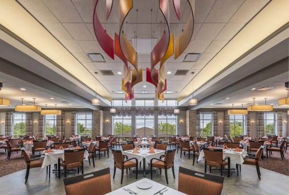 Elegant dining room with tables set for meals