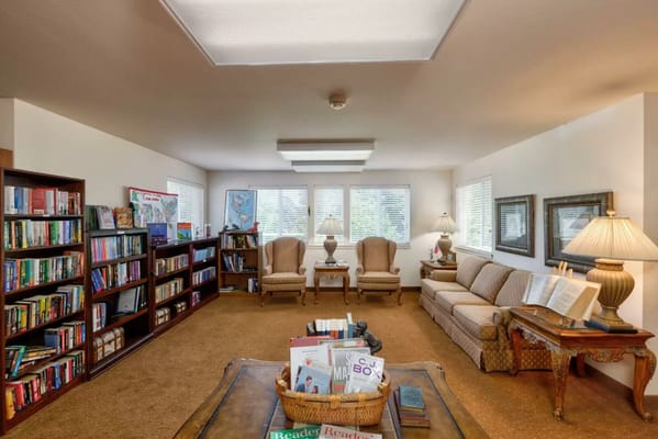 Cozy common area with bookshelves and seating