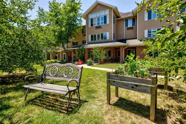 Outdoor seating area with benches and garden