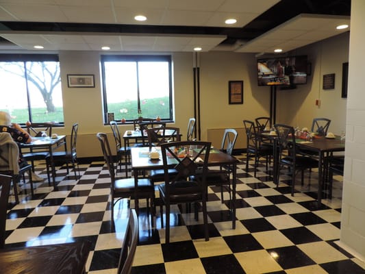 Dining area with tables and chairs in interior space