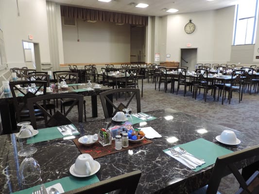 Interior view of a dining room with set tables