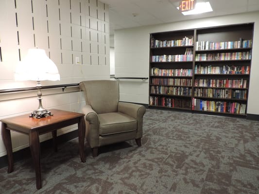 Cozy reading nook with bookshelf and armchair
