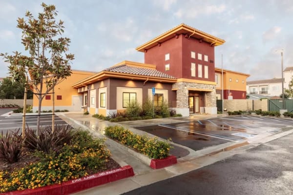 Exterior of Newport Beach Memory Care facility showcasing colorful architecture