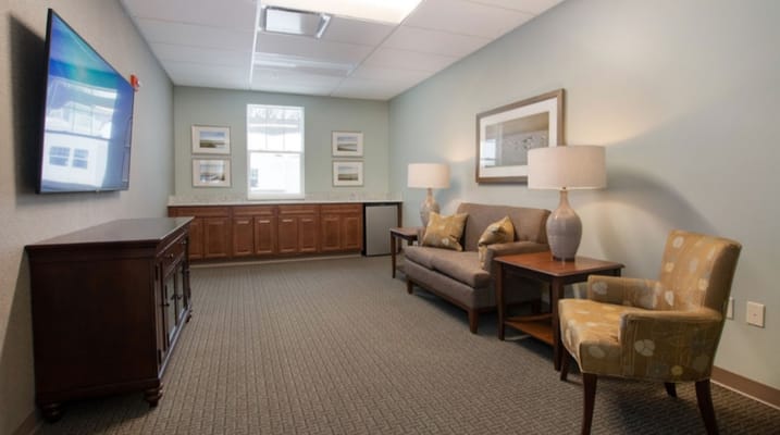 Cozy common area with seating and TV