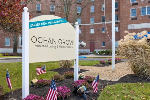 Sign for Ocean Grove Assisted Living & Memory Care showing 'Under New Management'