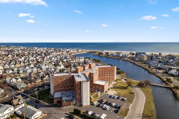Aerial view of Seaton Ocean Grove Assisted Living & Memory Care near the ocean.