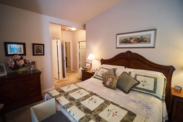 Cozy private resident room with decor and a bed