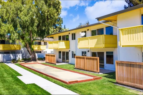 Outdoor space with bocce ball court and balconies