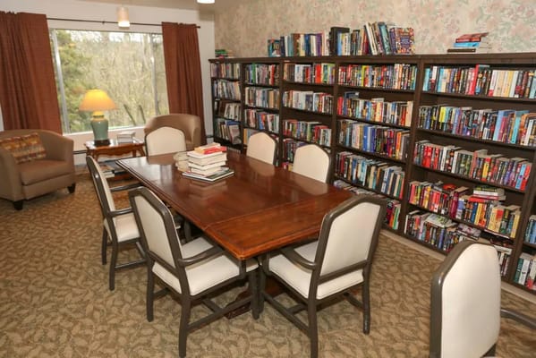 Common area with bookshelves and dining table