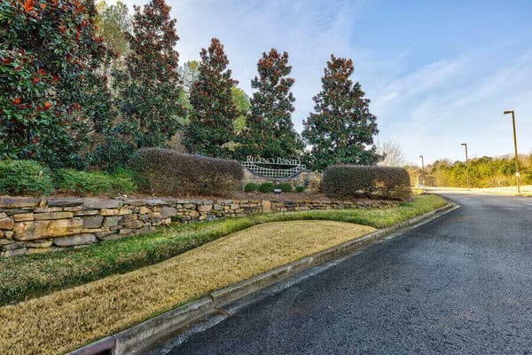 Well-maintained entrance to Regency Pointe with lush greenery