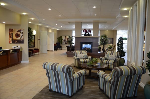 Inviting living room with striped chairs and a fireplace