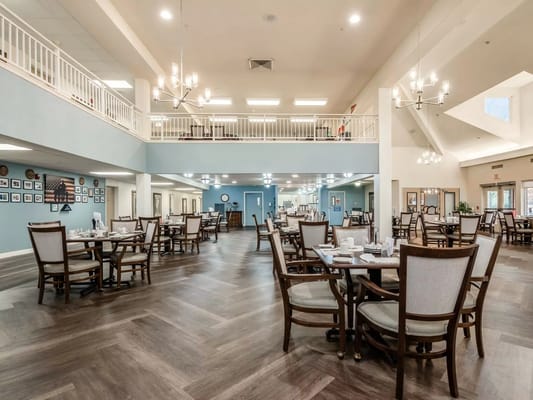 Dining area with tables and chairs in a spacious setting