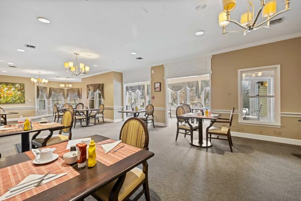 Interior view of the dining room at Seaton Towson with tables and chairs.