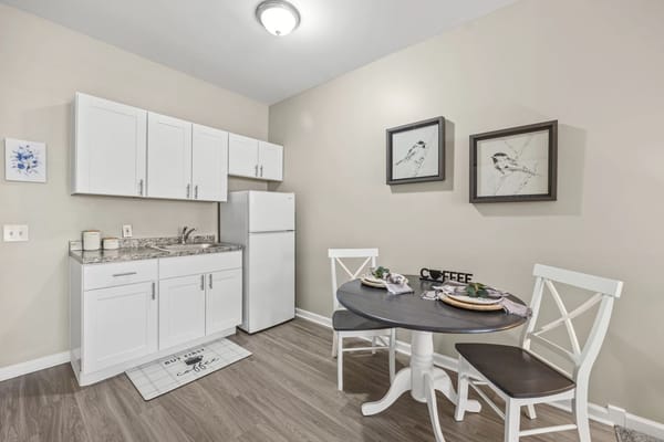 Bright and modern kitchenette with dining set